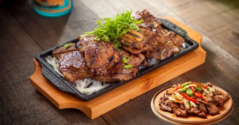 A plate of tender Instant Pot Korean Beef garnished with sesame seeds and green onions