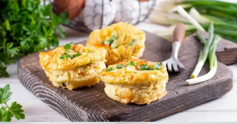 "Healthy sous vide egg bites served on a plate with fresh herbs, showcasing their fluffy texture and vibrant ingredients."