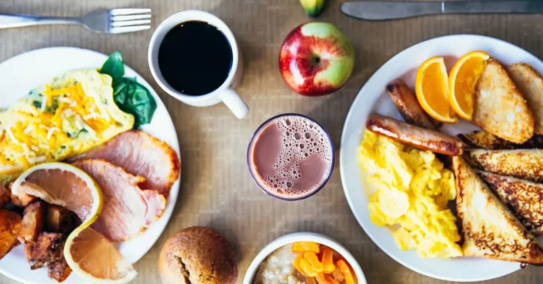 Delicious breakfast meal with avocado toast, oatmeal bowl, and fresh fruits