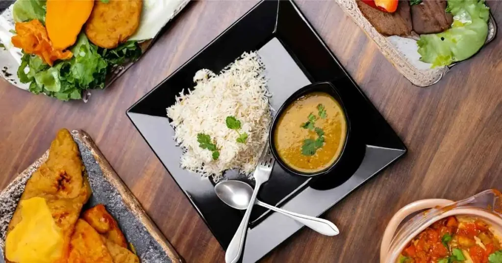 Vegetarian fried rice served in a bowl with chopsticks on the side