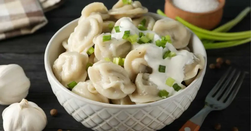 Instant Pot Chicken and Dumplings served in a bowl with creamy broth and dumplings.