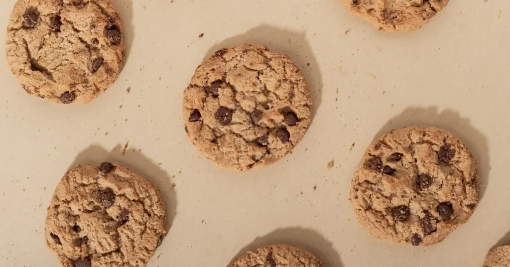 Freshly baked cake mix cookies on a cooling rack.