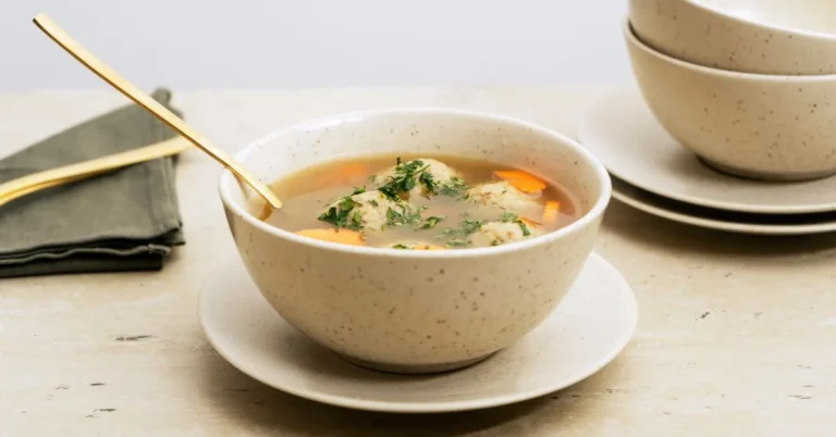 A comforting bowl of caldo de pollo with chicken, vegetables, and fresh cilantro.