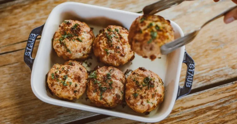 Chef John’s Italian Meatballs served with rich tomato sauce and garnished with fresh parsley.