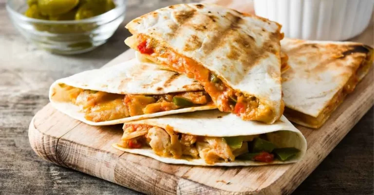 Golden brown chicken quesadillas served with a side of salsa and guacamole.