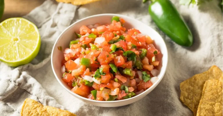 Classic Pico de Gallo with fresh diced tomatoes, onions, jalapeños, cilantro, and lime in a bowl.