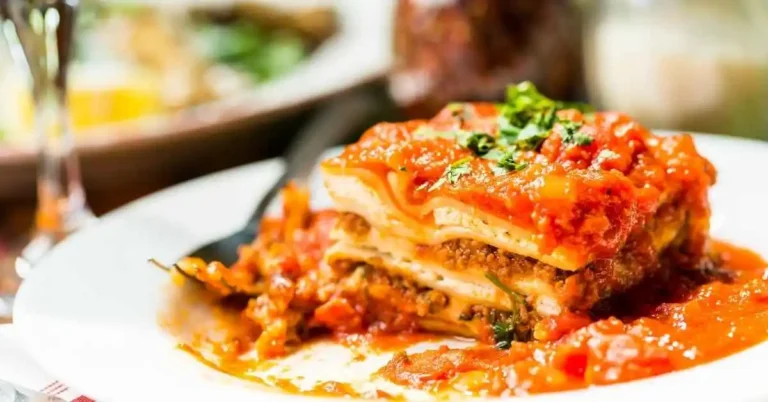 Instant Pot Lazy Lasagna with layers of pasta, cheese, and marinara sauce served in a bowl.