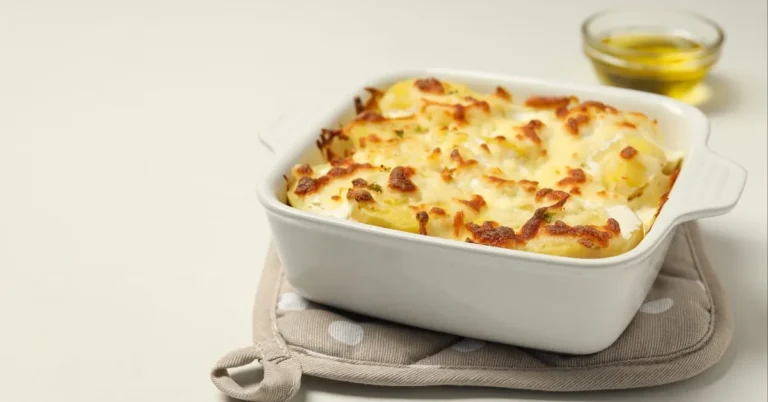 Golden-brown Pineapple Casserole with a crunchy cracker topping, served in a baking dish.