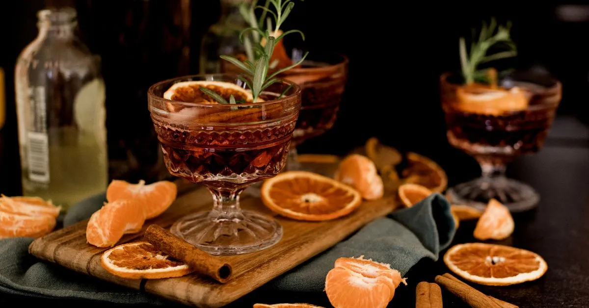 A glass of Jager Bomb cocktail with a shot glass of Jägermeister dropped into a glass of energy drink.