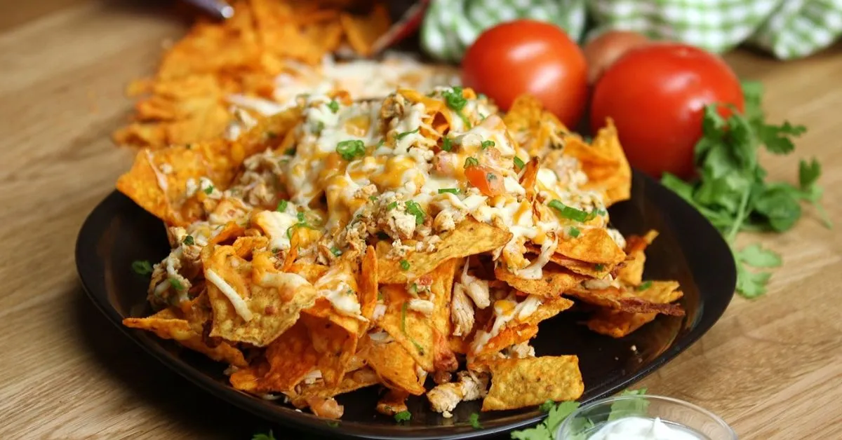 A delicious serving of Easy Dorito Casserole, layered with crunchy Doritos, cheese, and flavorful ground beef.