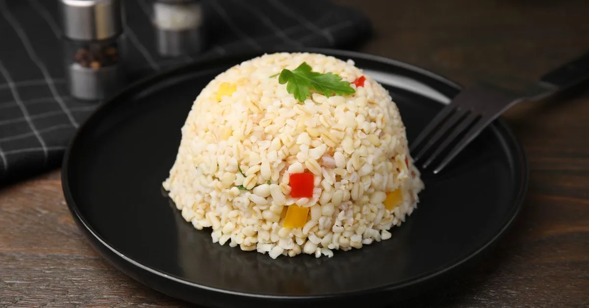 A fluffy serving of Jasmine rice cooked perfectly in an Instant Pot, garnished with fresh herbs.