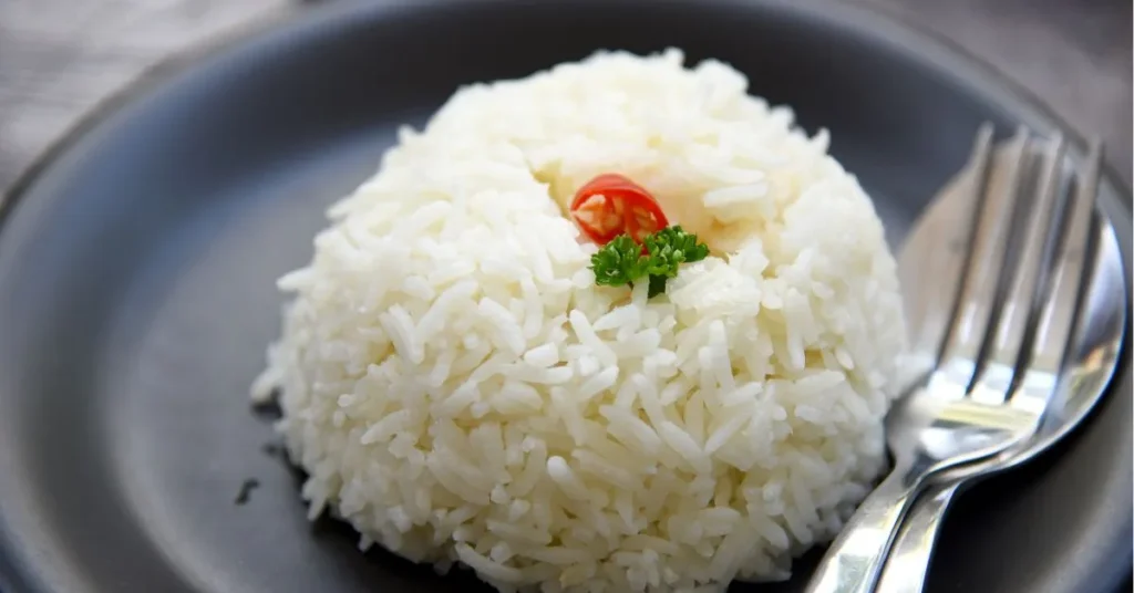 A bowl of aromatic, fluffy Jasmine rice with a delicate, fragrant texture.