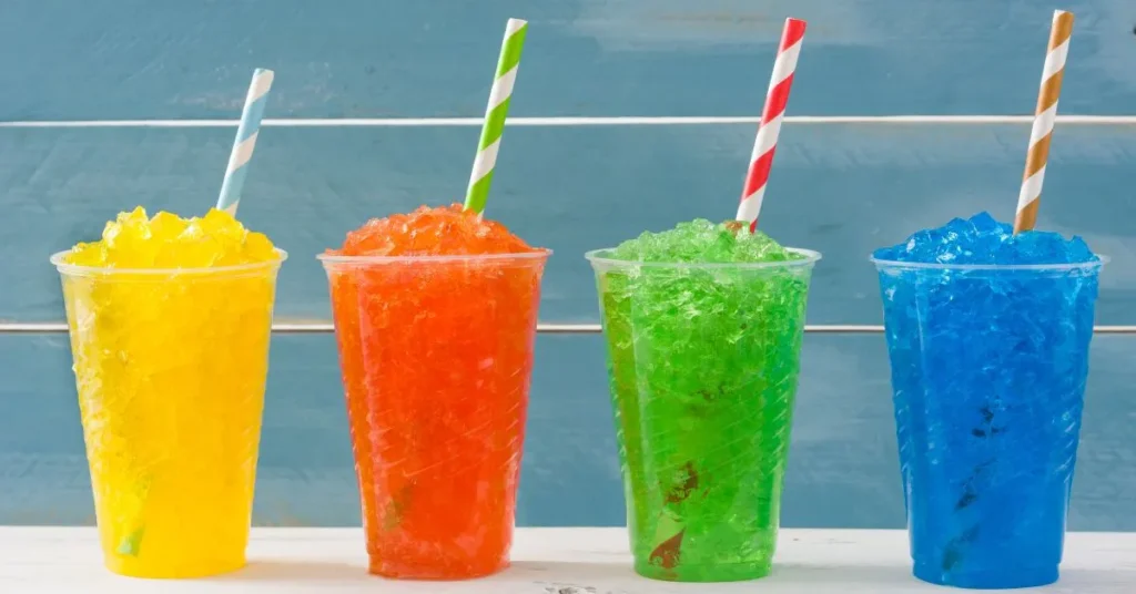 A variety of colorful snow cones with different flavors.