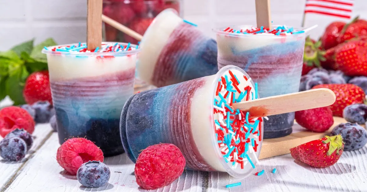 Bright and colorful snow cones topped with flavored syrup.