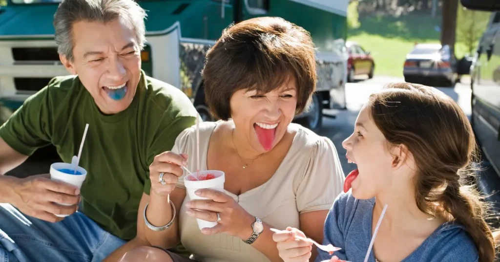 Different types of snow cones with various flavors and toppings.