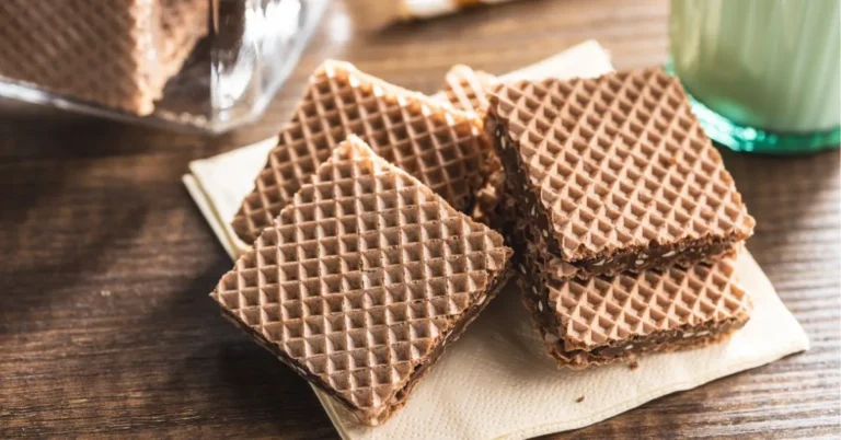 A stack of crispy and delicious wafer cookies with a creamy filling, perfect for a sweet snack.